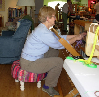 Sitting on tuffet to thread